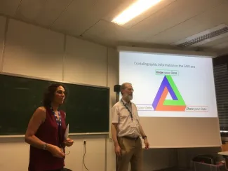 Two people giving a lecture