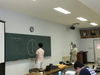 Person at the chalkboard