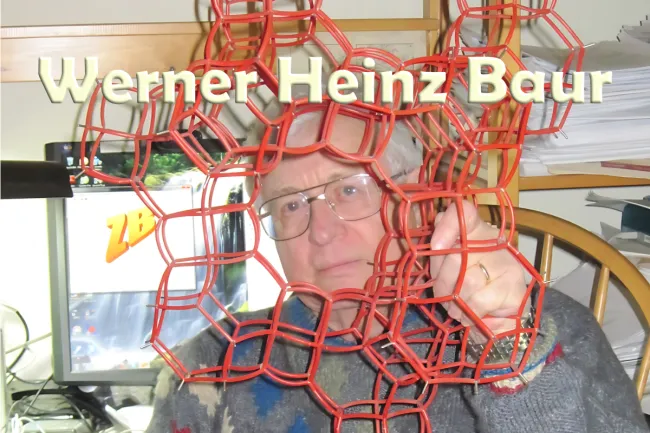  Werner in his office looking through a structure model of a zeolite. 
