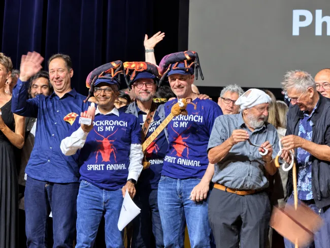 Ig Nobel Laureates celebrating on stage
