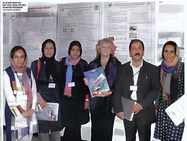 group photo in front of posters